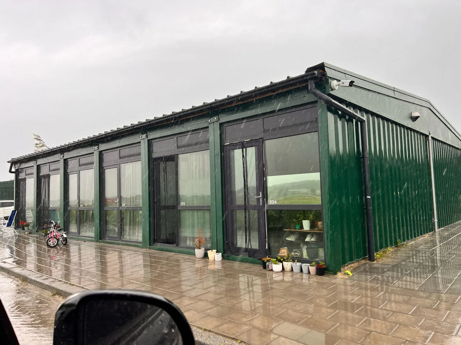 40FT container conversion — open-plan kitchen and dining area.