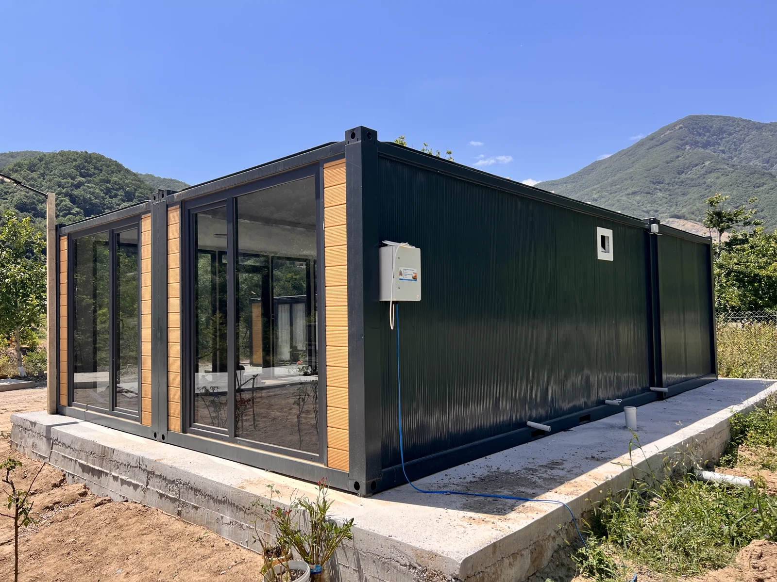 Series 600C XL garden room — wider site view with paved walkway.