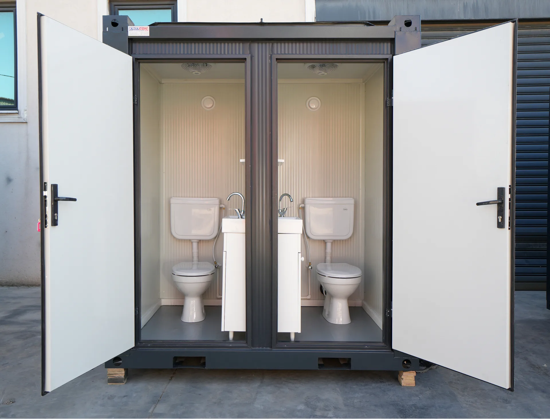 T135D double WC — interior cubicle view with WC and toilet roll holder.