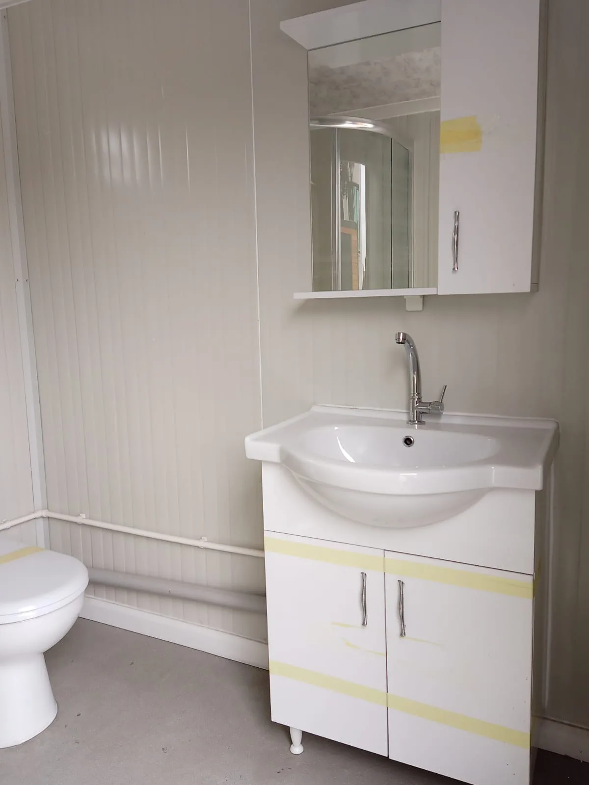 T210B large bathroom — three-quarter view with ventilation grille.